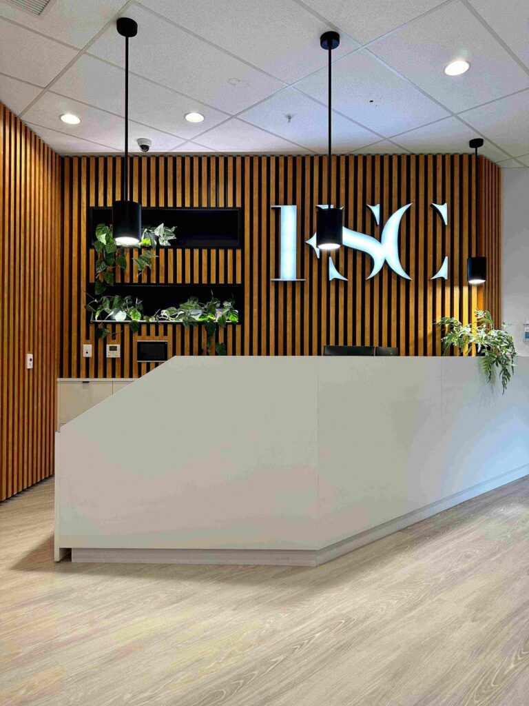 Filleul Surgical Centre - reception desk and timber feature wall