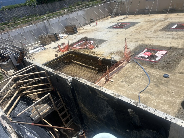 The excavated basement level, with formwork and pile caps ready for pouring